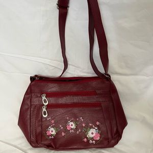 Red purse with flowers